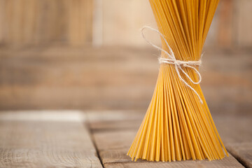 Bundle Raw Spaghetti Tied With Rope White Surface