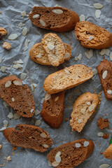 Classical and chocolate biscotti with almonds on a piece of baking paper