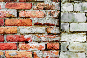 Texture of a brick wall with cracks and scratches which can be used as a background