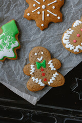 christmas gingerbread cookies on a baking tray. Gingerbread man, christmas tree. 