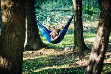 The girl is resting in a hammock