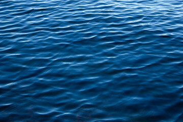 Light ripples on the deep blue water. Waves on the sea.Background.