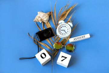 Calendar for August 7 : the name of the month of August in English, cubes with the numbers 0 and 7,...