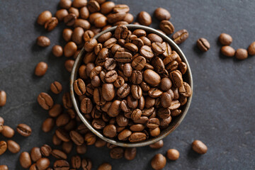 Arabica beans in bowl on grey