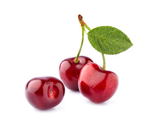 Sweet cherries  isolated on white background cutout. Ripe berries with leaf closeup.