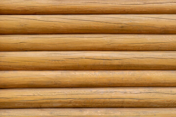 The texture of the wall of a wooden log house., background.