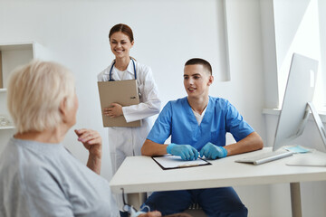 doctor nurse examines patient hospital service