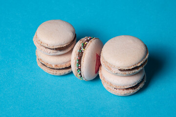 pink macaroons on a blue backround 