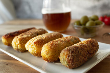 
Typical croquettes of Spanish cuisine. Traditional tapas of Spanish cuisine. Vegan tofu, sweet potato and mushroom croquettes.