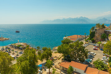 Naklejka na ściany i meble ANTALYA, TURKEY: Top view of the old town, the sea and the mountains on a sunny summer day in Antalya.