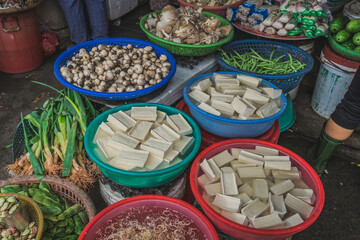 Different vegetables and tofu at a street market in asia. Hoi An, Vietnam