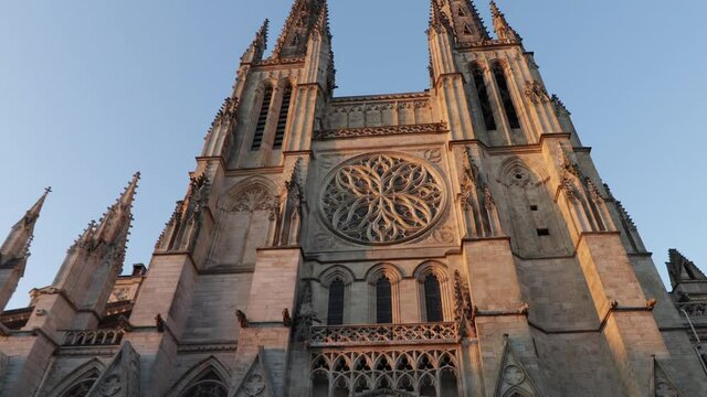 Bordeaux cathedral front side of the church wide shot moving tilt up during sunrise