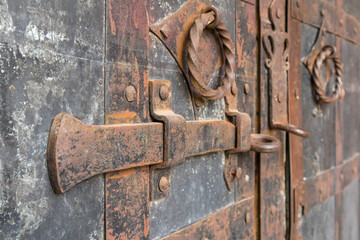 fragments of handles and bolts on the medieval gate