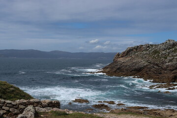 Typical image of the rocky Galician coastline with the rough sea, in Porto do Son, La Coruña