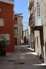 Image of a deserted street and houses in the fishing village of Porto do Son, Galicia.