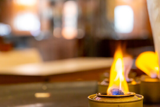 fire flame of a rechaud in a restaurant. blurred background