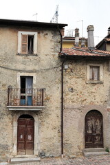Central Italy Rural Village Old House Facades with Wooden Doors, Chimneys and Iron Balcony