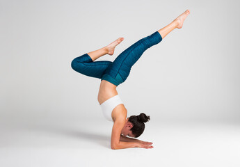 Young woman doing yoga pose