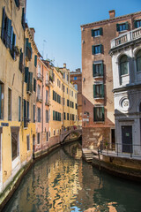 Fototapeta na wymiar reflections on the canals of Venice in March, Italy 2019