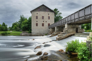 Fototapeta na wymiar Old Lang mill and dam at Lang century village