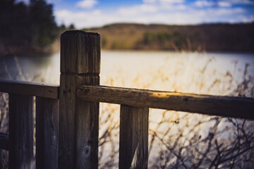 wooden fence on the lake