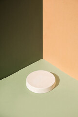 Abstract minimal scene with geometrical forms. Cylinder podiums on green and beige background. Abstract background. Scene to show cosmetic podructs. Showcase, display case. 3d render.