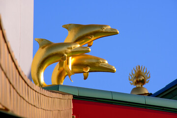 golden dragon statue on the roof