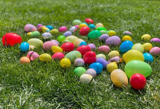 Multicolored Easter eggs on grass