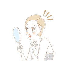 鏡でお肌をチェックする女性