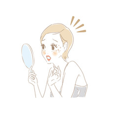 鏡でお肌をチェックする女性