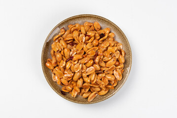 delicious snack fried spicy peanuts on white background
