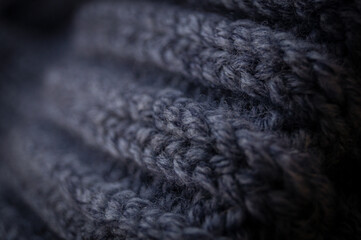Close-up of the texture of a handmade knitted sweater. Rows of loops.