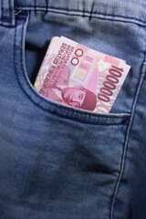 rupiah money inside of jeans pocket indonesia currency - 448170905