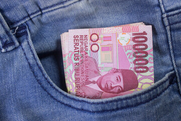 rupiah money inside of jeans pocket indonesia currency