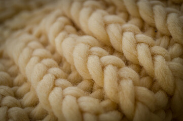 Close-up of the texture of a handmade knitted sweater. Rows of loops.