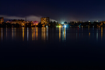 Obraz premium View on a river Dnieper and city Dnipro at night