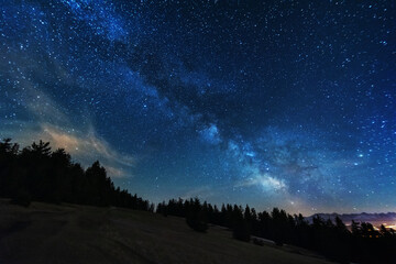 Bright starry sky with the milky way on the background of High Tatras mountains 