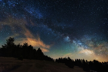 Plakat Bright starry sky with the milky way on the background of High Tatras mountains 