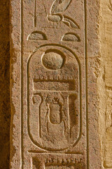 Egyptian ancient hieroglyphs on the stone wall in a temple of Hatshepsut