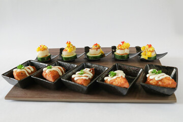 Christmas bites salad and prawn paste bread canapés in small plate in white background Christmas festival menu