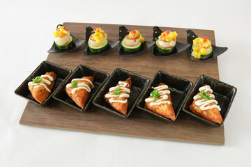 Christmas bites salad and prawn paste bread canapés in small plate in white background Christmas festival menu