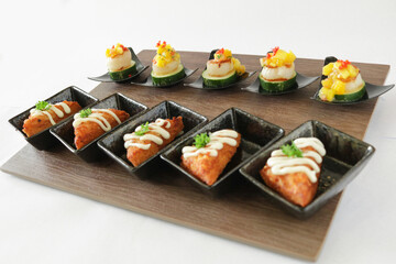 Christmas bites salad and prawn paste bread canapés in small plate in white background Christmas festival menu