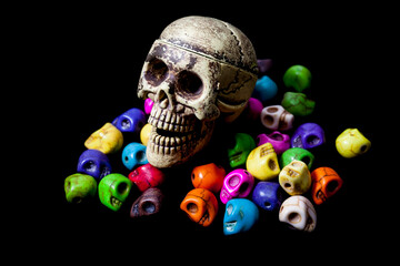 Model of human skull on black background.
