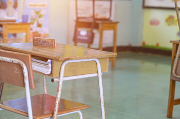 Back to school concept. School empty classroom, Lecture room with desks and chairs iron wood for studying lessons thailand without young student.School closed due to covid 2019