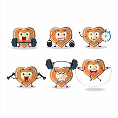 A healthy gingerbread heart cartoon style trying some tools on Fitness center