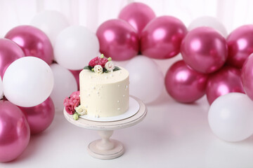Obraz na płótnie Canvas Birthday decoration with cake and balloons on a white background. Digital prop background. White cake decorated with flowers 