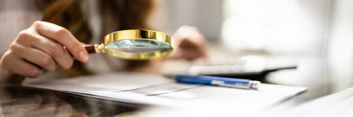 Business Fraud Investigation Using Magnifying Glass. Finance