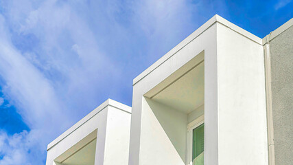 Pano Flat roof and projecting window frames of house in Huntington Beach California