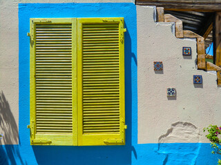 Colorful doors and windows of the restaurant pizzeria inside the swimming pool center in Olmedo,...