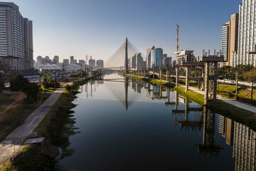 View of Pinheiros River and  the Octavio Frias de Oliveira Bridge, known as the Estaiada Bridge in background, south side of Sao Paulo, SP